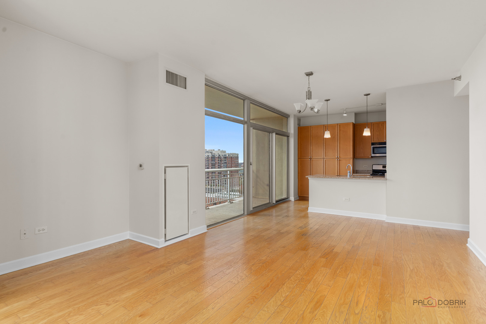 1400 South Michigan Avenue, Unit 1404 Chicago, IL 60605 - Photo 6 of 26 a view of a kitchen with a sink and refrigerator