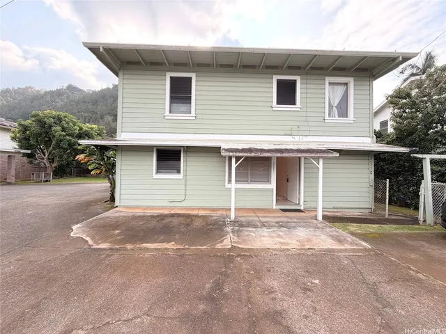 a view of a street with a garden