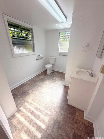 a bathroom with a toilet sink and a tub