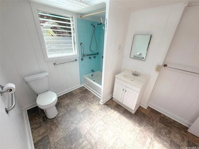 a view of a hallway with washer and dryer