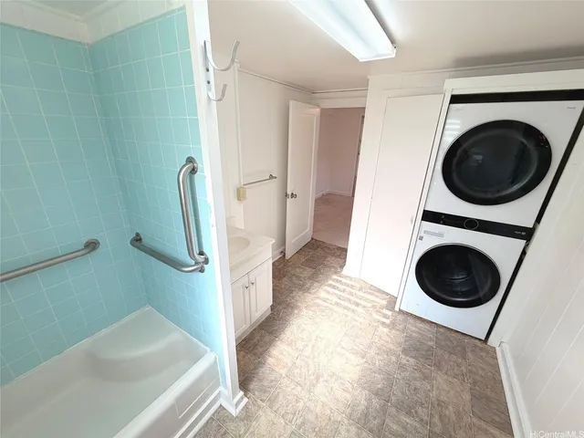 a view of a hallway with washer and dryer