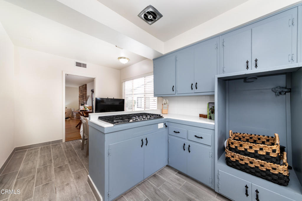1305 Solita Road Pasadena, CA 91103 - Photo 12 of 33 a kitchen with white cabinets and appliances