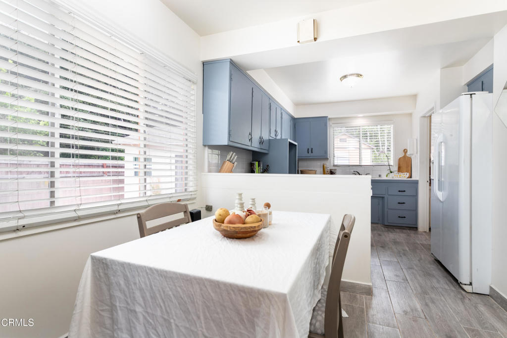 1305 Solita Road Pasadena, CA 91103 - Photo 13 of 33 a kitchen with stainless steel appliances sink refrigerator table and chairs