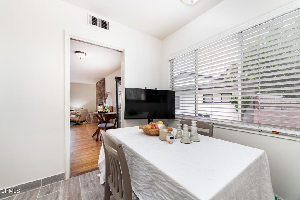 1305 Solita Road Pasadena, CA 91103 - Photo 14 of 33 a view of a dining room with furniture and a window
