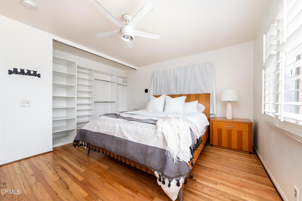1305 Solita Road Pasadena, CA 91103 - Photo 15 of 33 a bedroom with a bed and wooden floor