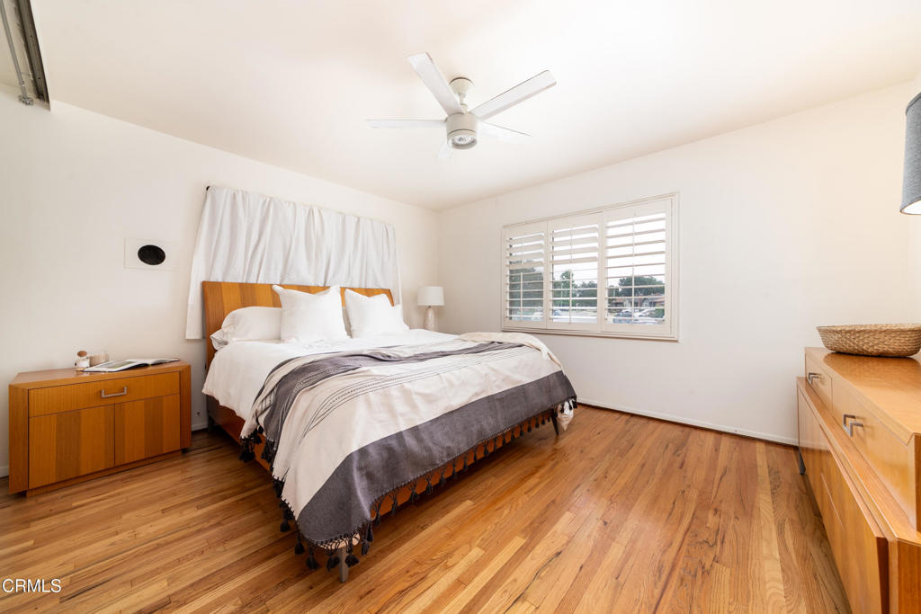 1305 Solita Road Pasadena, CA 91103 - Photo 16 of 33 a bedroom with a bed and wooden floor