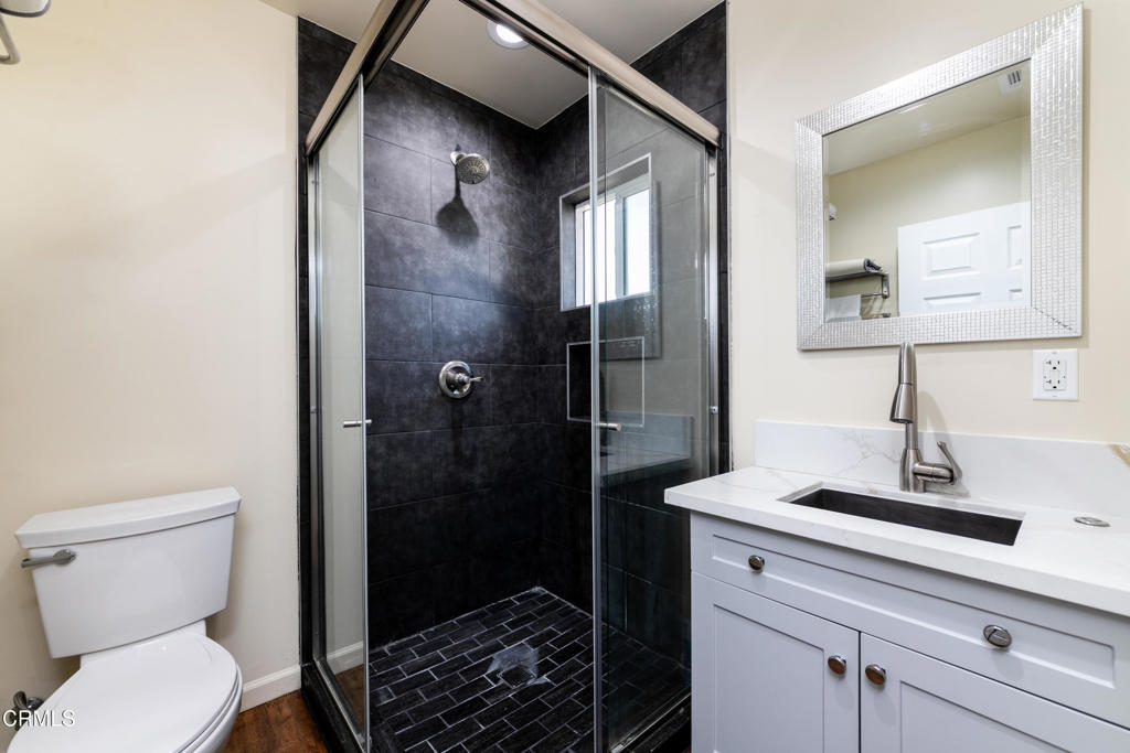 1305 Solita Road Pasadena, CA 91103 - Photo 22 of 33 a bathroom with a toilet sink and shower