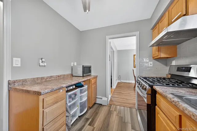 a kitchen that has a stove and a sink