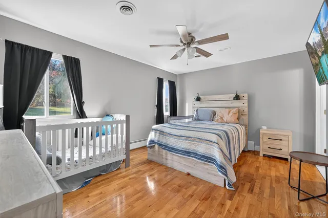 a bedroom with a bed and a window