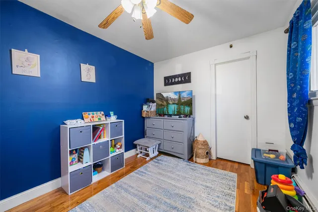 a view of a workspace with furniture and wooden floor