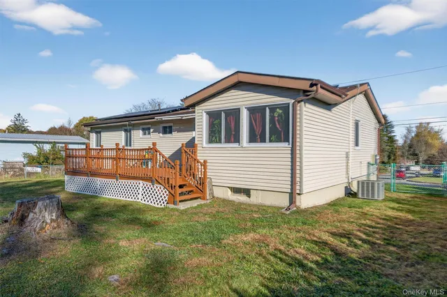 a house with a yard and a large tree