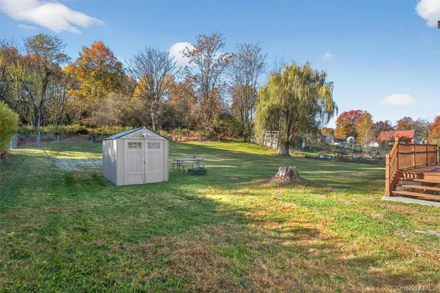 a view of a house with a big yard