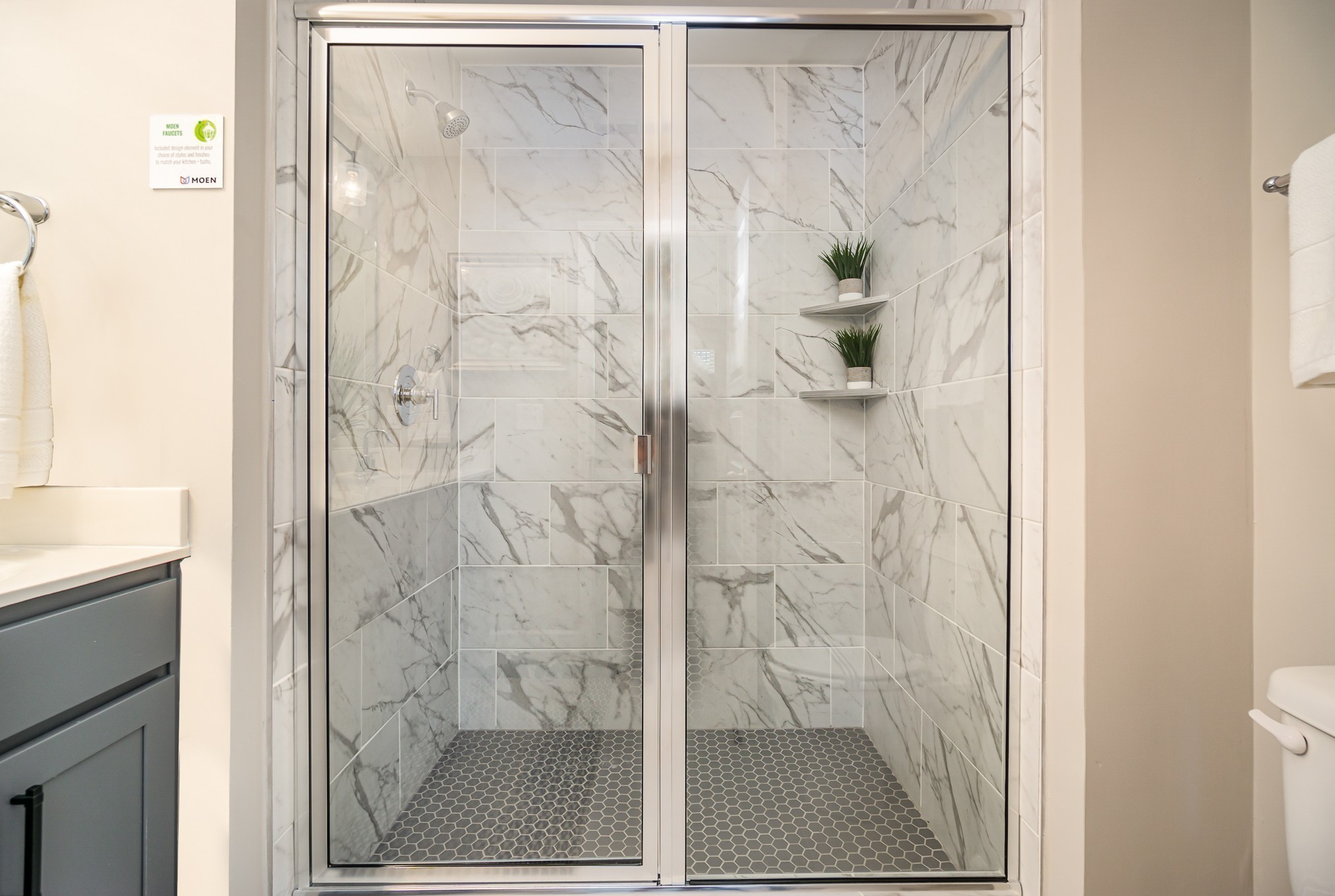 1752 Fenway Loop Antioch, TN 37013 - Photo 25 of 38 a bathroom with a glass shower door