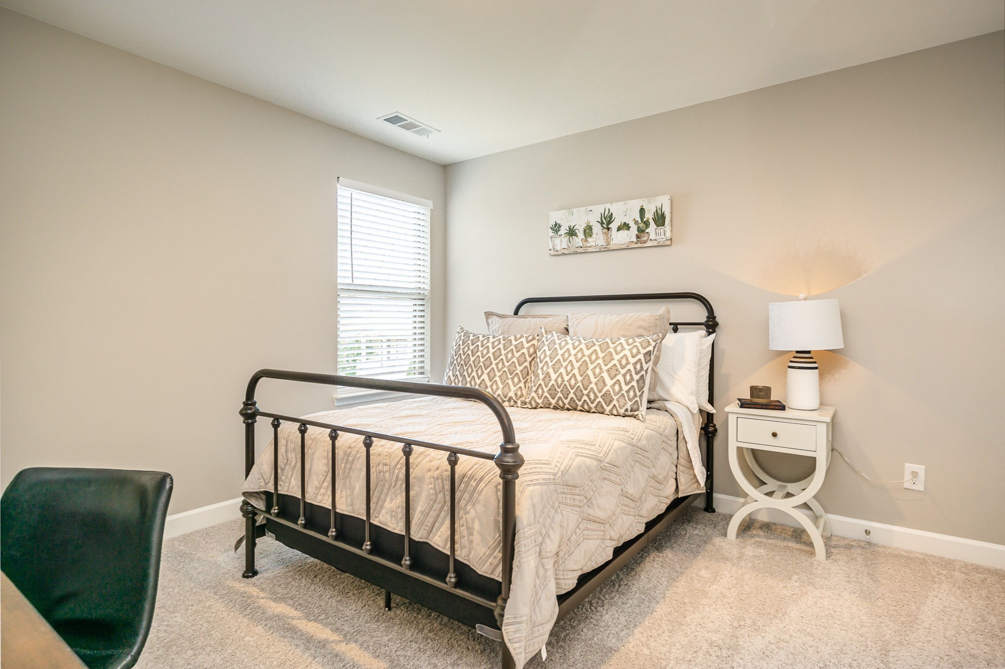 1752 Fenway Loop Antioch, TN 37013 - Photo 26 of 38 a bedroom with a bed and a chair