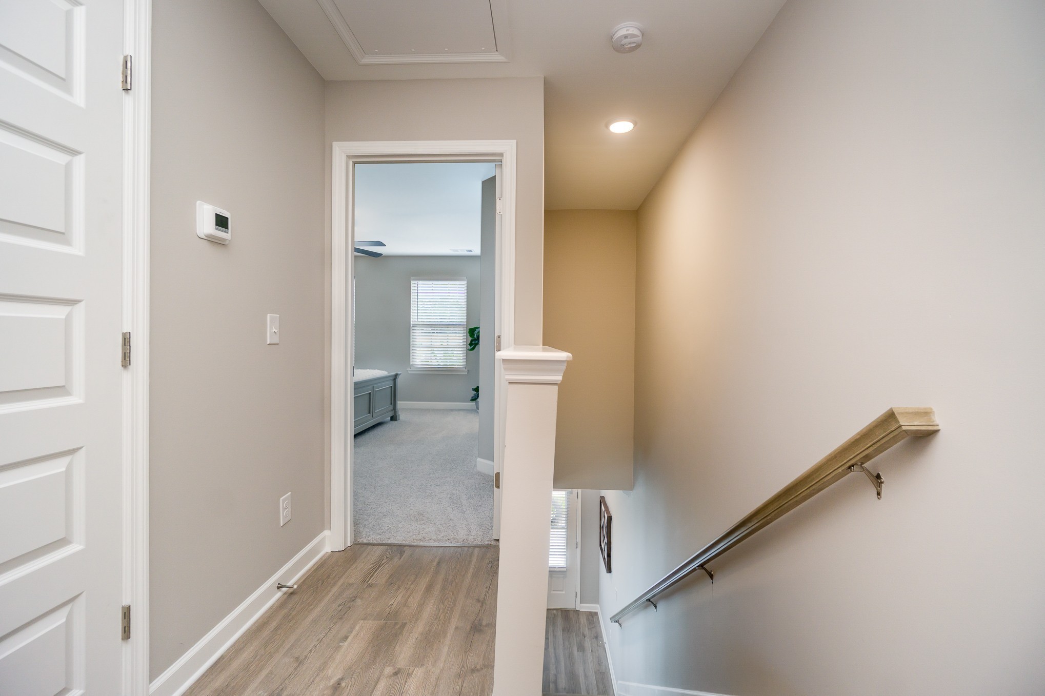 1752 Fenway Loop Antioch, TN 37013 - Photo 29 of 38 a view of a hallway with wooden floor and staircase