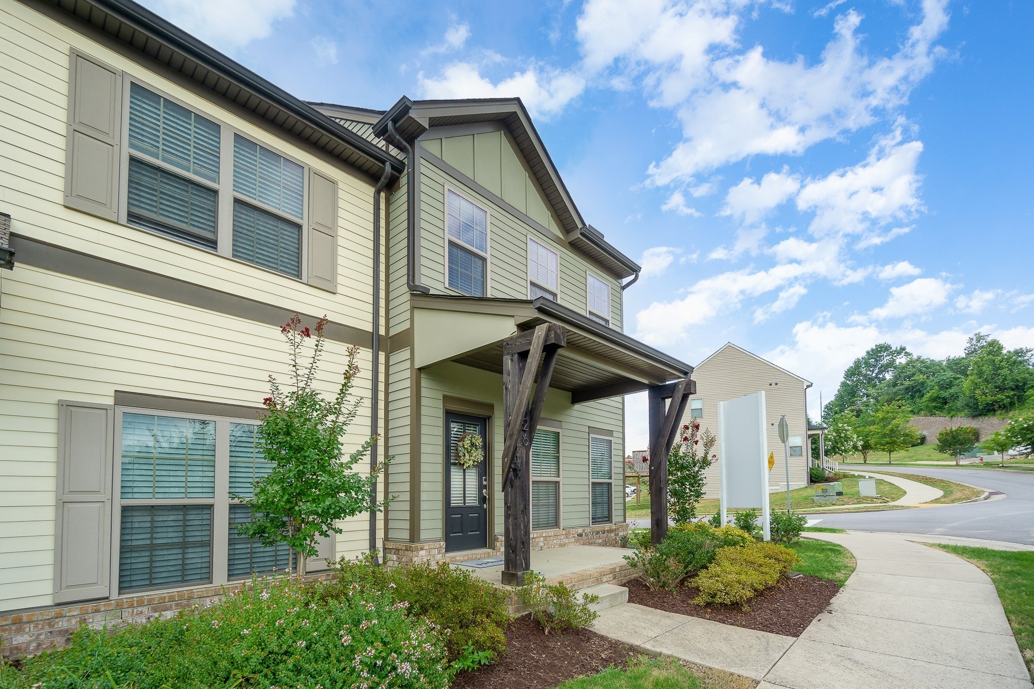 1752 Fenway Loop Antioch, TN 37013 - Photo 34 of 38 a front view of a house with garden