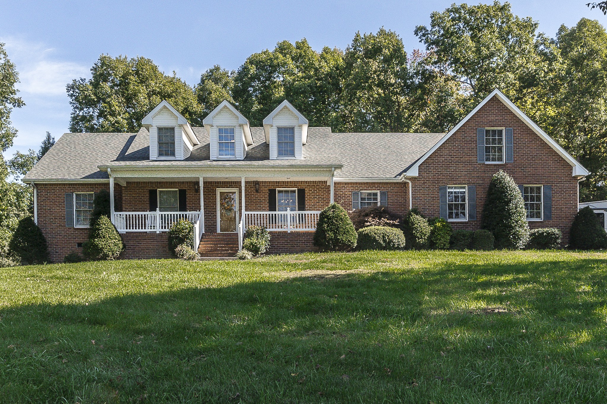 182 Calvert Ridge Road Westmoreland, TN 37186 - Photo 1 of 50 a front view of a house with a garden