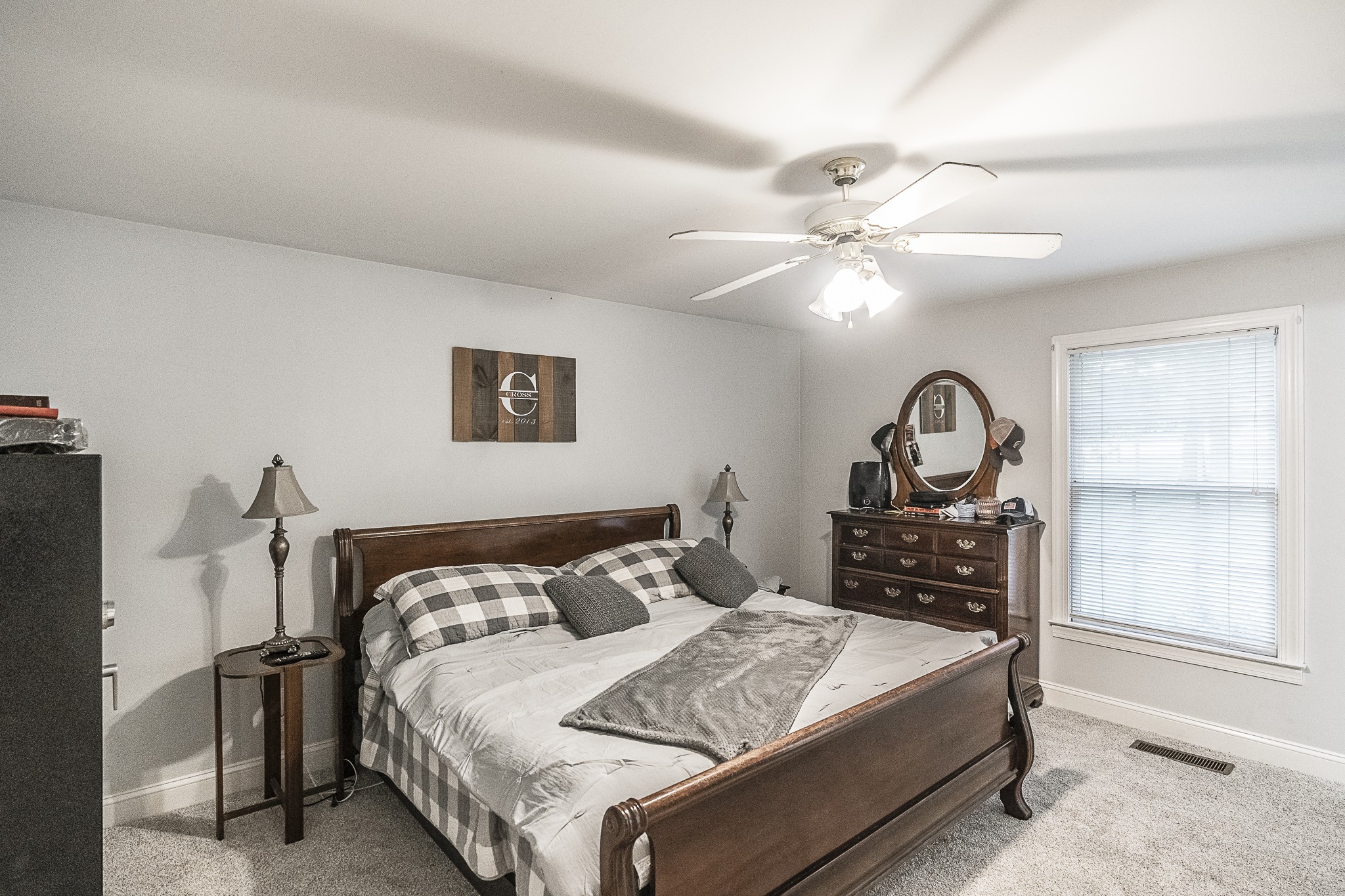 182 Calvert Ridge Road Westmoreland, TN 37186 - Photo 24 of 50 a bedroom with a bed and a chandelier