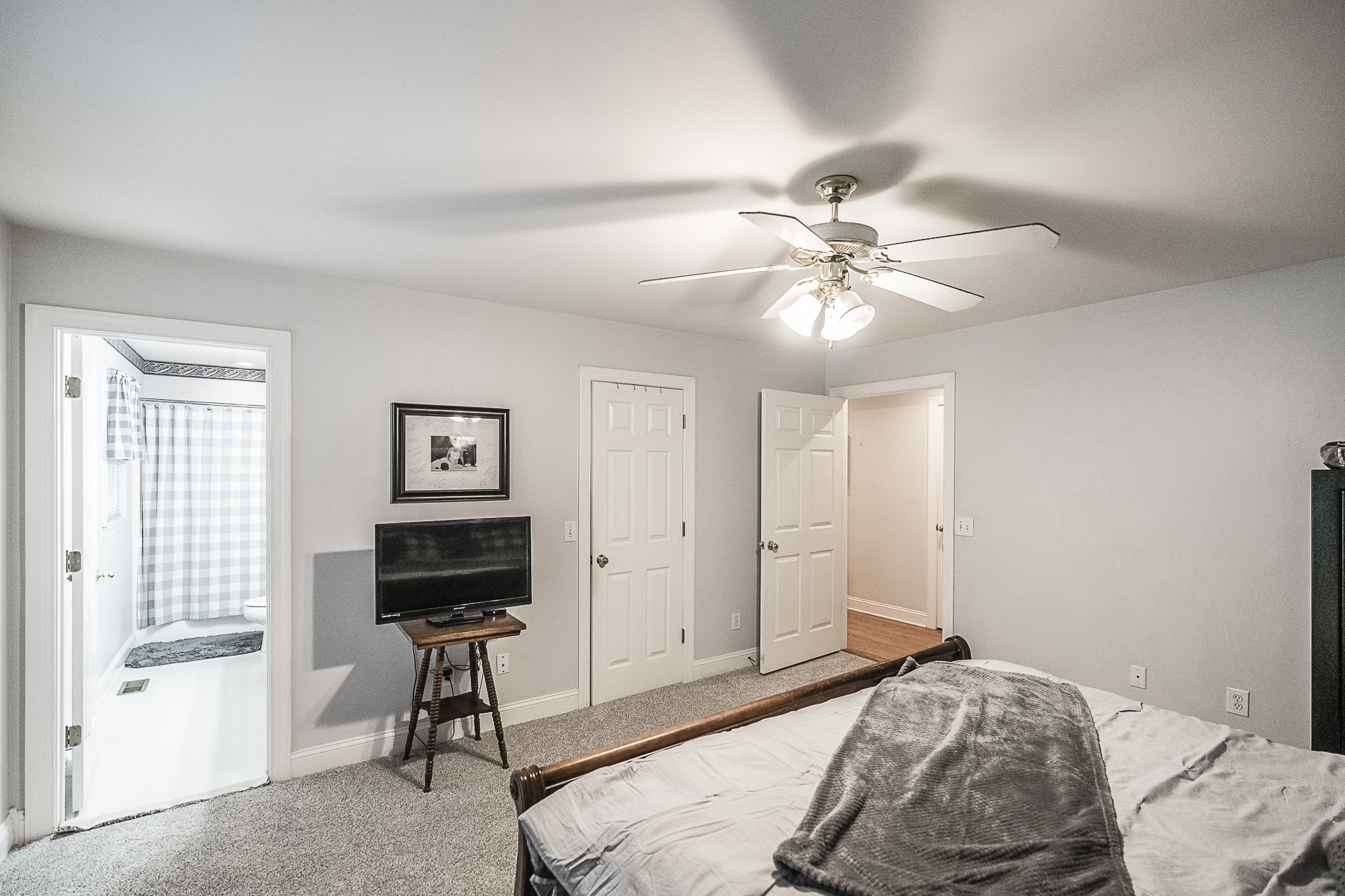 182 Calvert Ridge Road Westmoreland, TN 37186 - Photo 25 of 50 a bedroom with a bed and a chandelier