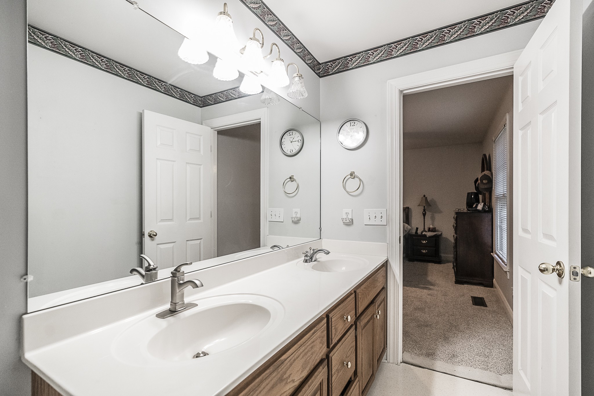 182 Calvert Ridge Road Westmoreland, TN 37186 - Photo 27 of 50 a bathroom with a double vanity sink mirror and shower
