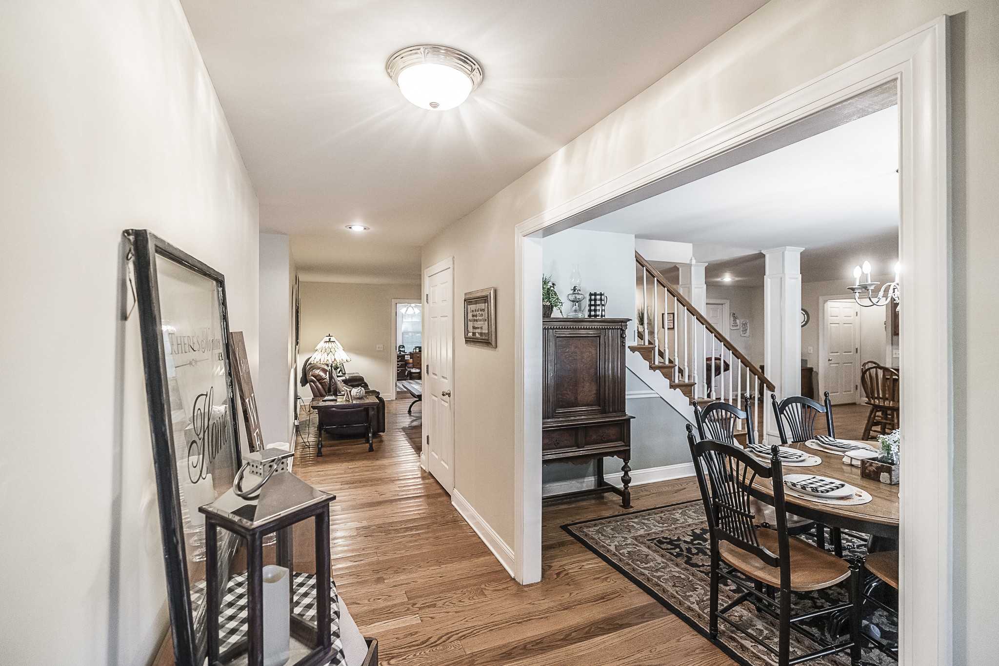 182 Calvert Ridge Road Westmoreland, TN 37186 - Photo 7 of 50 a view of a hallway with wooden floor and a livingroom