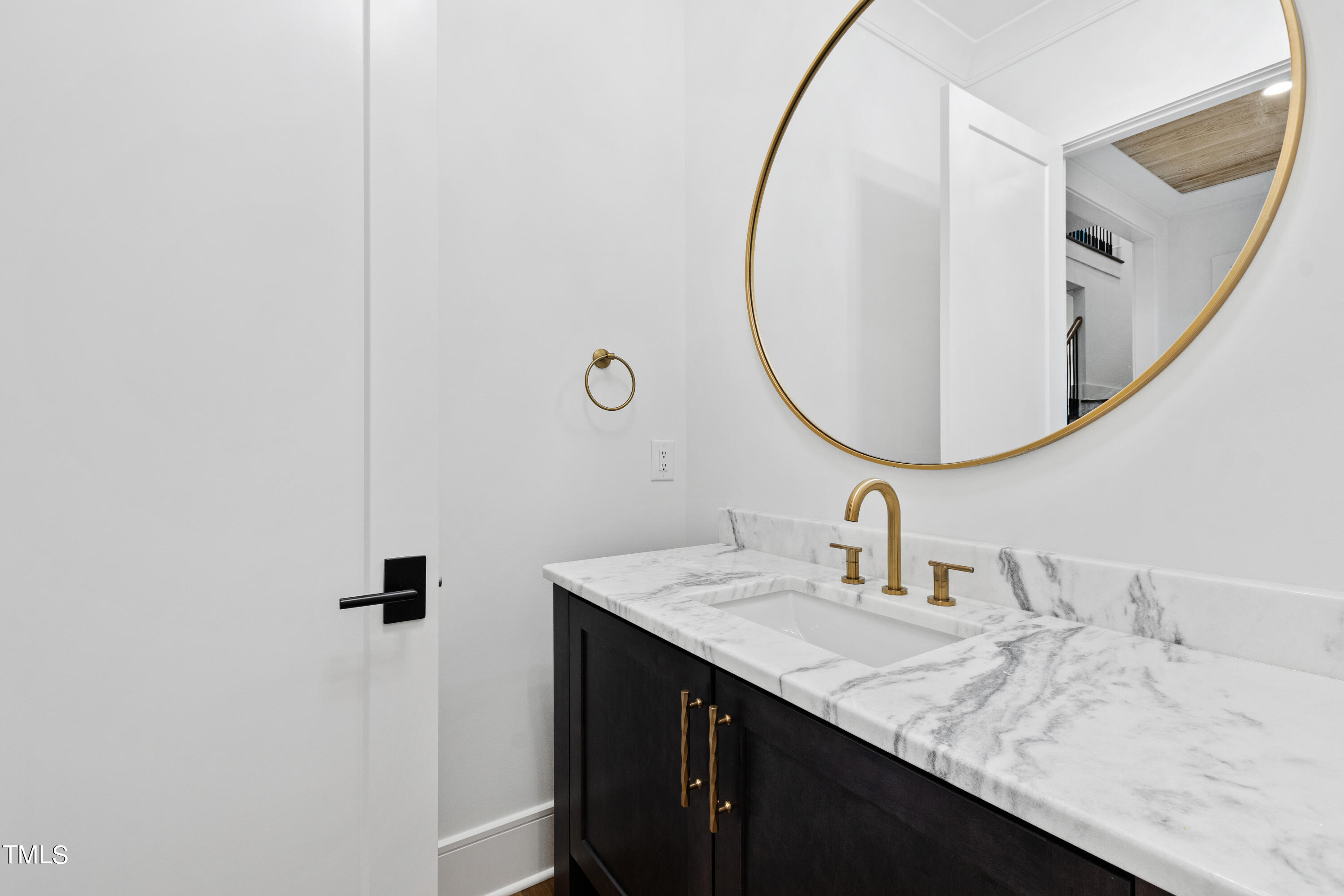 2604 Cromwell Road Raleigh, NC 27608 - Photo 60 of 74 a bathroom with a sink and a mirror