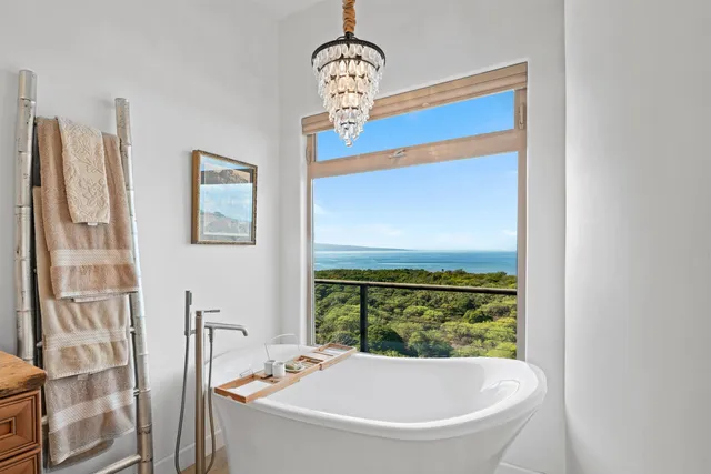 a bathroom with a bathtub and shower