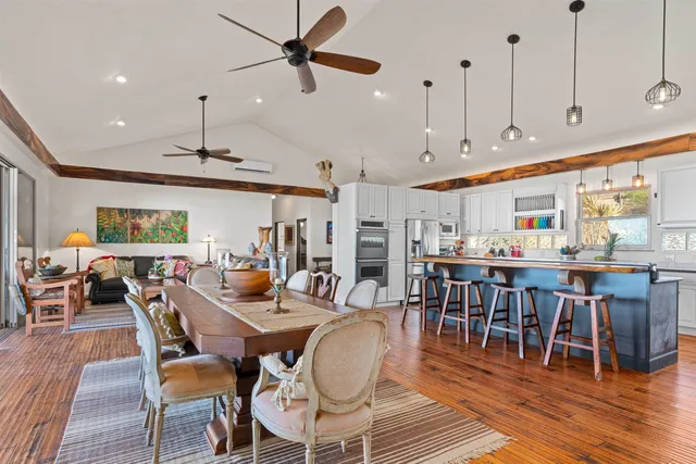 a view of a dining area with furniture window and wooden floor