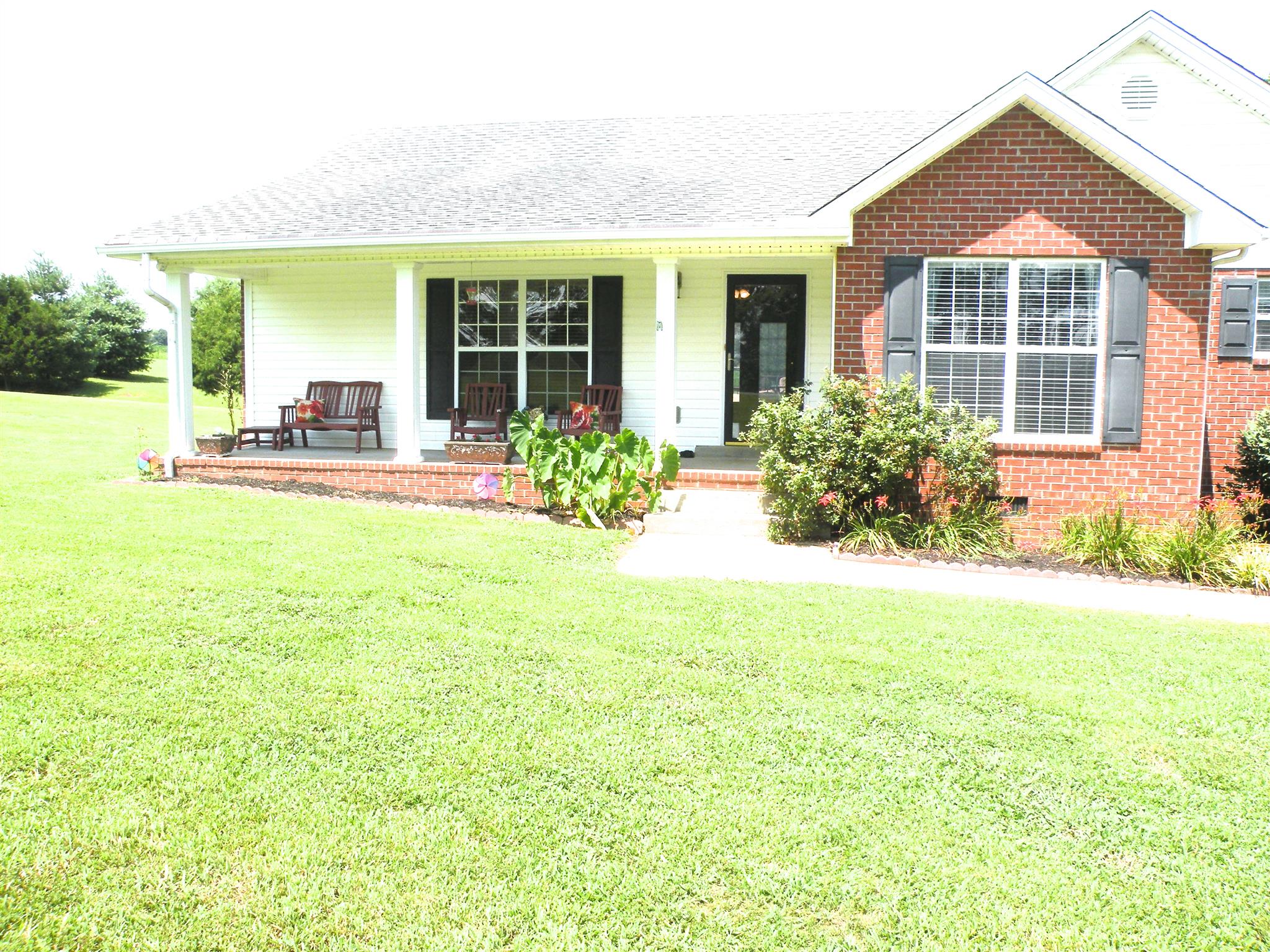 183 Lear Road Portland, TN 37148 - Photo 1 of 30 a view of a house with backyard sitting area and garden