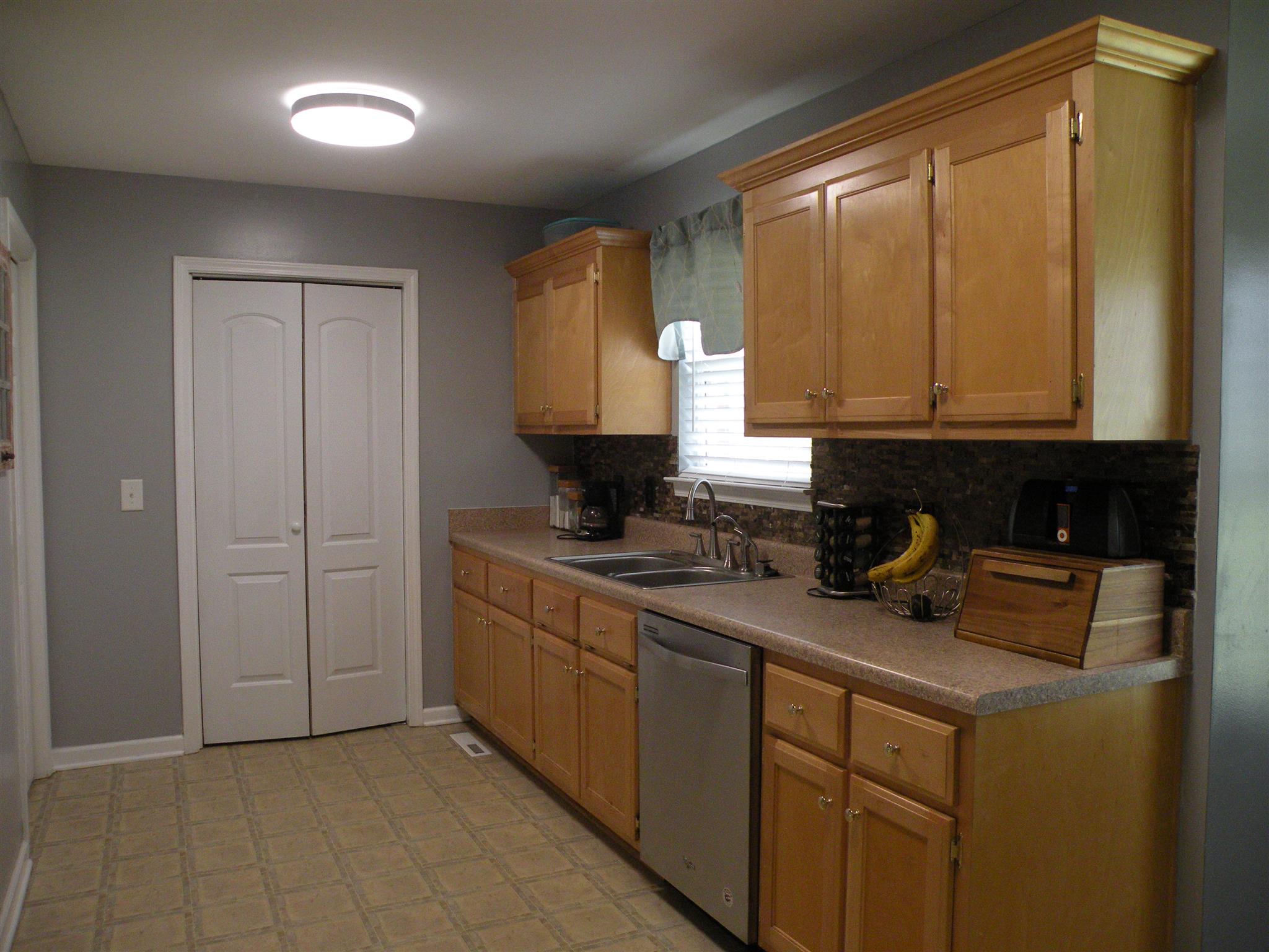 183 Lear Road Portland, TN 37148 - Photo 14 of 30 a kitchen with a sink cabinets and a window