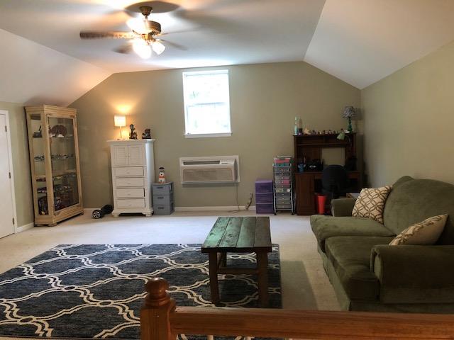 183 Lear Road Portland, TN 37148 - Photo 21 of 30 a living room with furniture and a chandelier