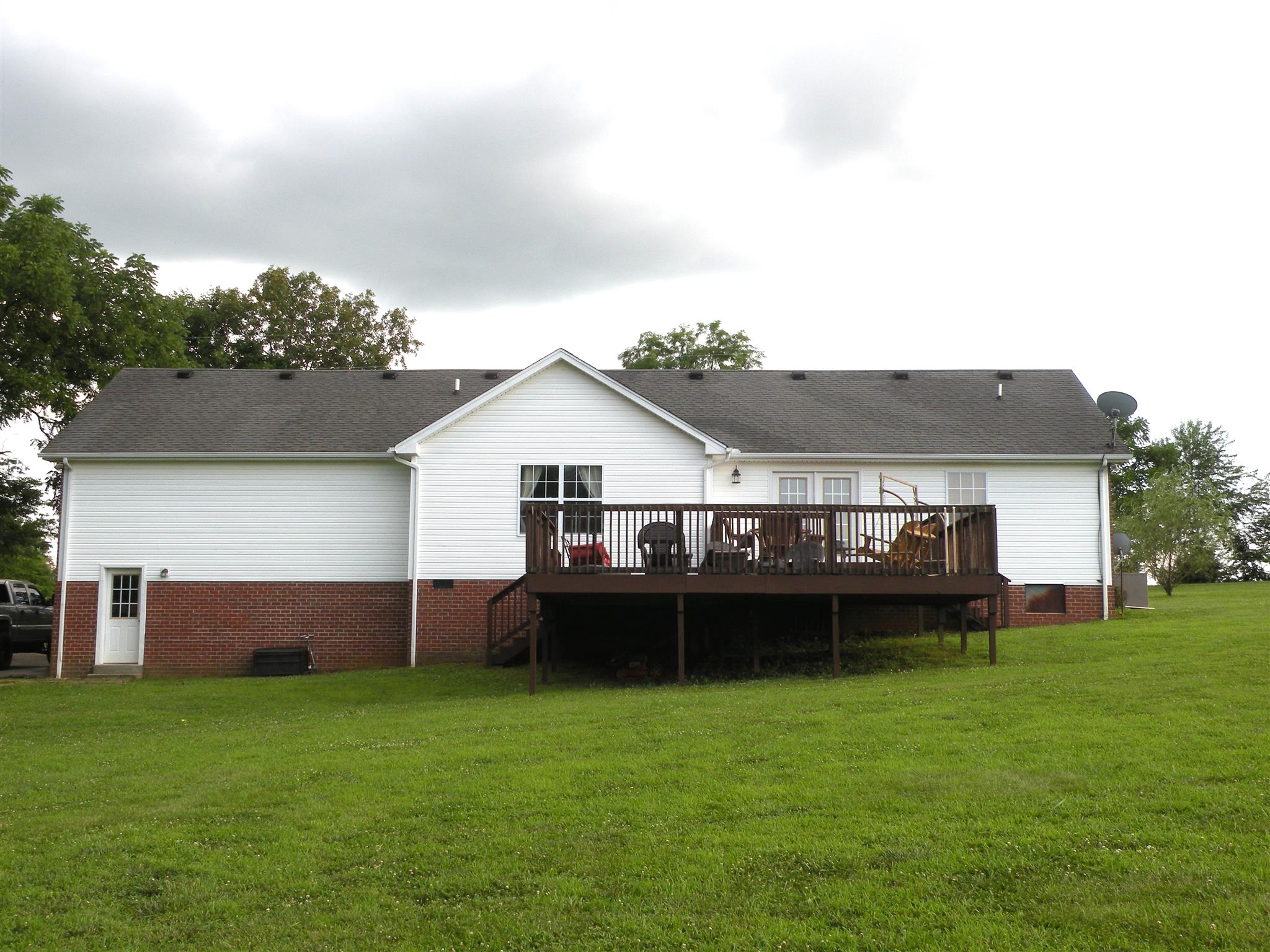 183 Lear Road Portland, TN 37148 - Photo 27 of 30 a view of a house with a garden and deck