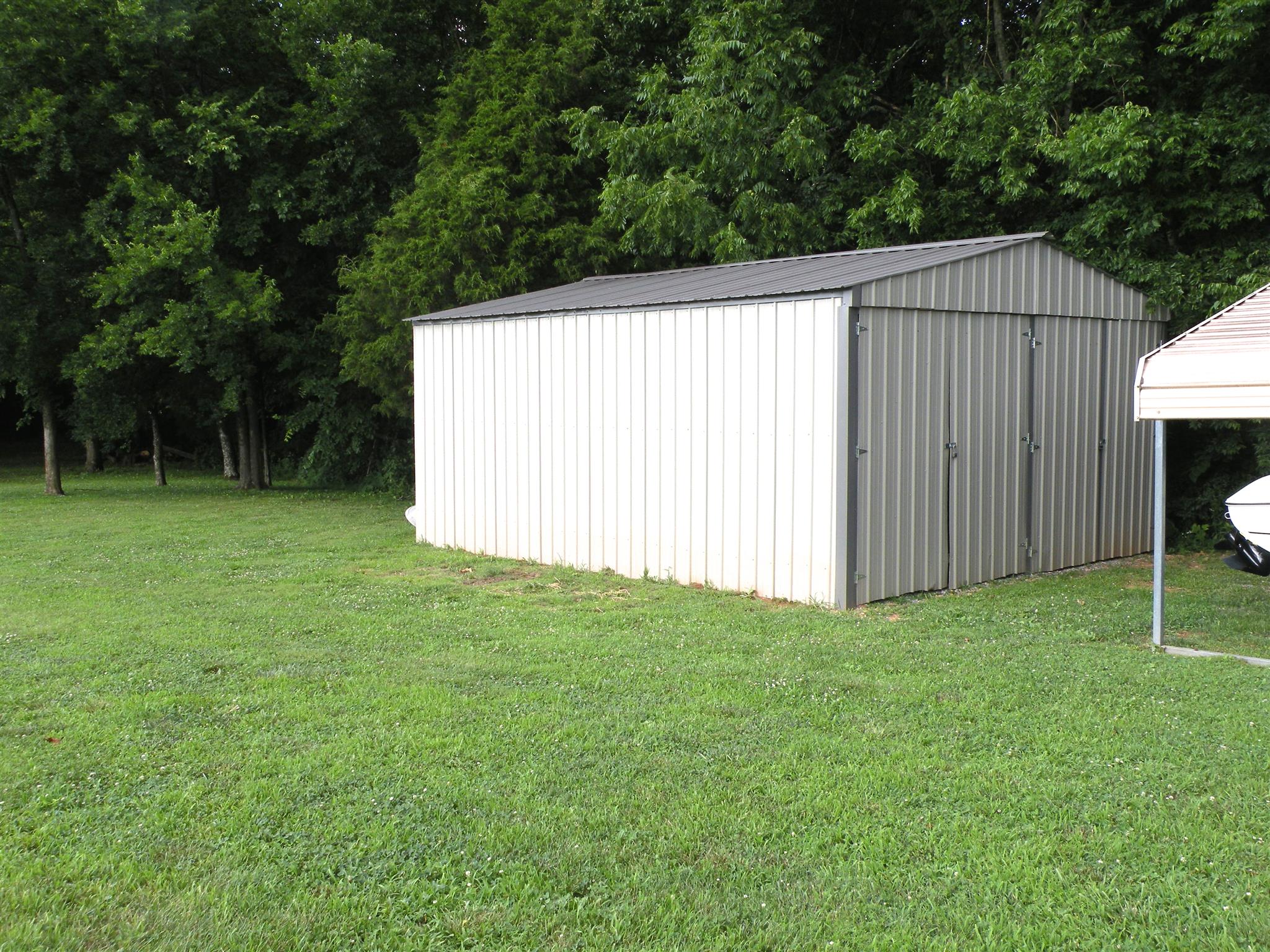 183 Lear Road Portland, TN 37148 - Photo 30 of 30 a view of a backyard with a garden and entertaining space