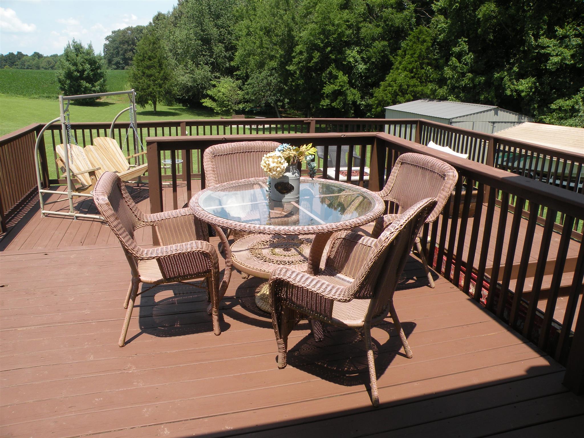 183 Lear Road Portland, TN 37148 - Photo 9 of 30 a view of a chairs and table on the deck