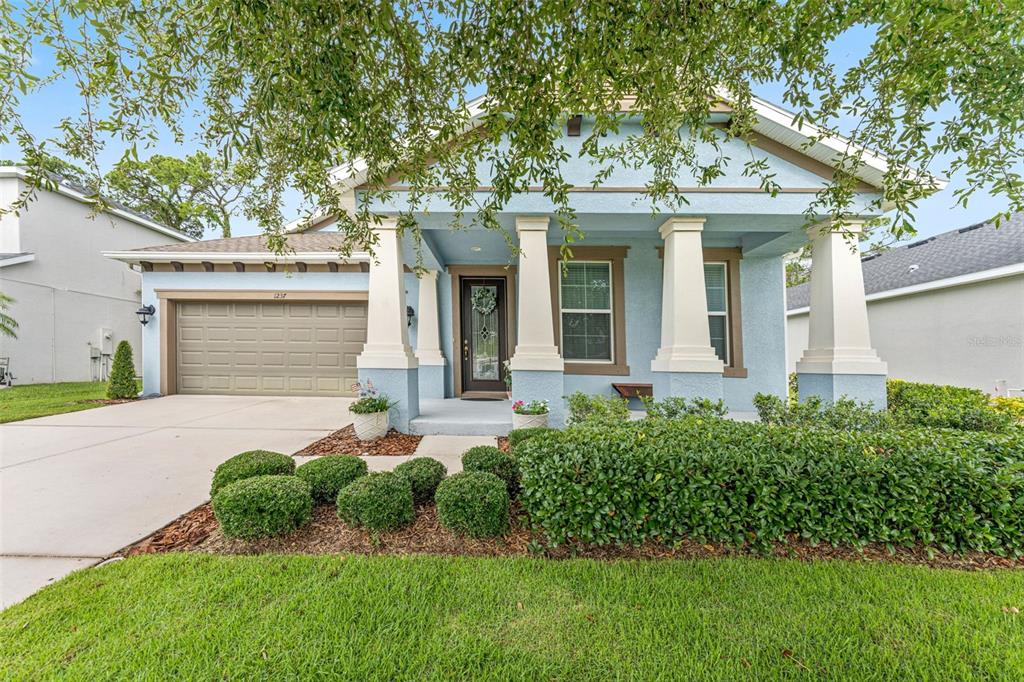 1237 Windy Bay Shoal Tarpon Springs, FL 34689 - Photo 1 of 1 front view of a house with a yard