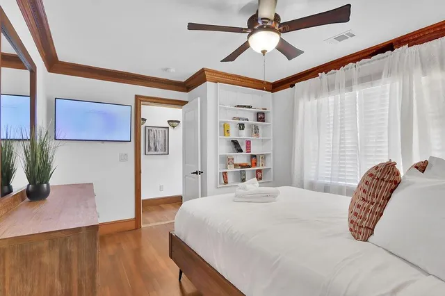 a living room with a couch and a flat screen tv