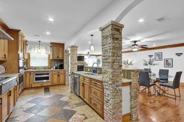 a dining room with furniture and a window