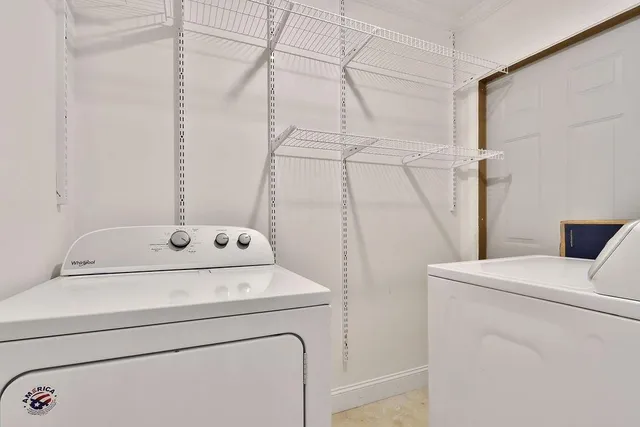 a bedroom with bed and wooden floor