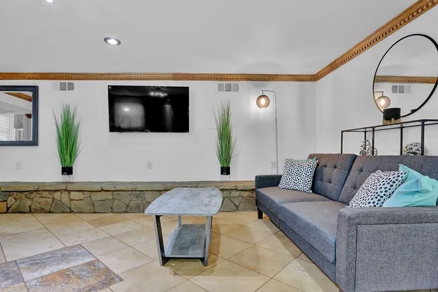 a bedroom with bed and window