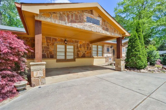 a view of a balcony with table and chairs