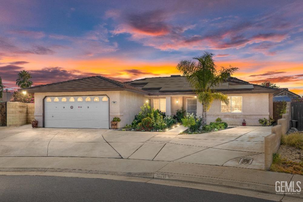Undisclosed Address Shafter, CA 93263 - Photo 1 of 42 a front view of a house with a garden and plants