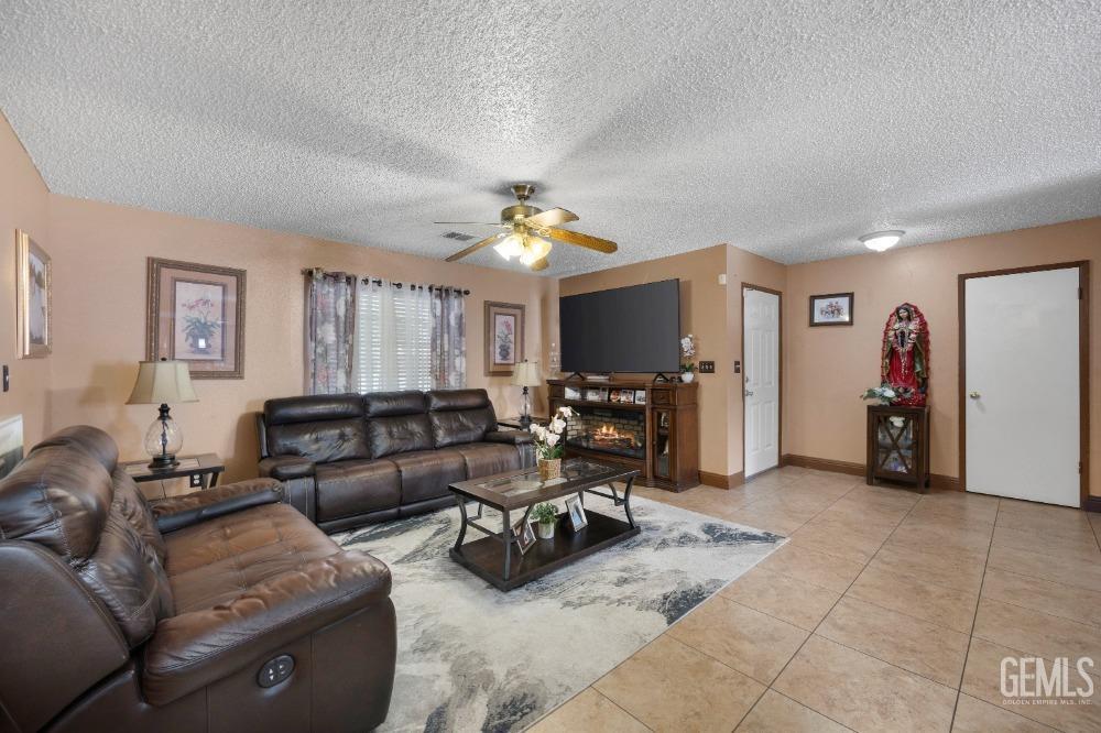 Undisclosed Address Shafter, CA 93263 - Photo 13 of 42 a living room with furniture and a flat screen tv