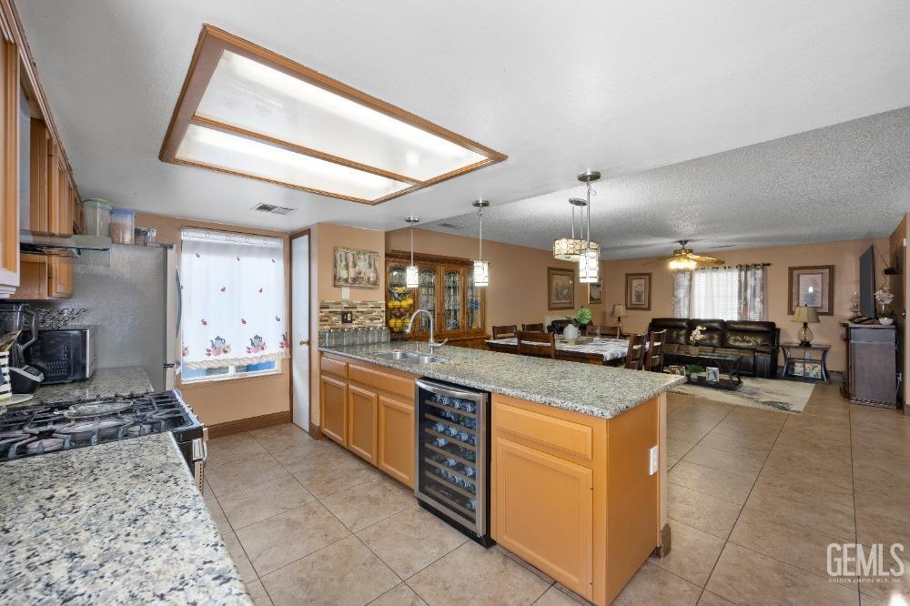 Undisclosed Address Shafter, CA 93263 - Photo 20 of 42 a large kitchen with a large counter top appliances and cabinets