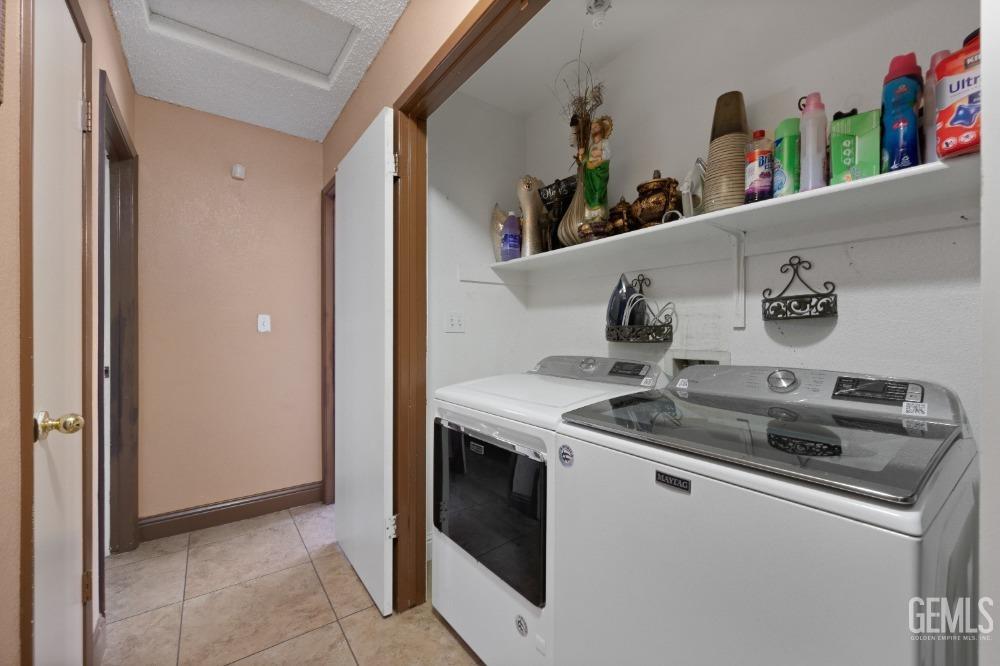 Undisclosed Address Shafter, CA 93263 - Photo 30 of 42 a kitchen with stainless steel appliances granite countertop a sink and a refrigerator