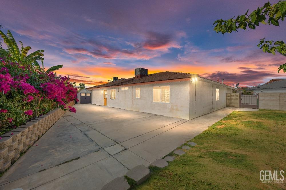 Undisclosed Address Shafter, CA 93263 - Photo 33 of 42 a front view of a house with a yard and garage