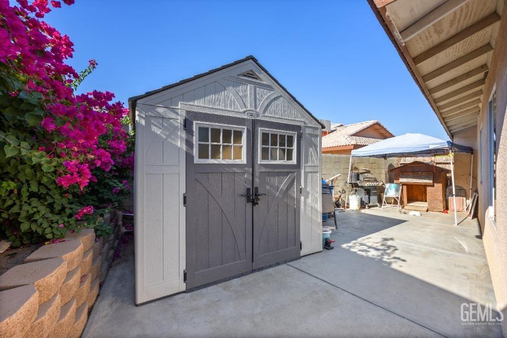 Undisclosed Address Shafter, CA 93263 - Photo 38 of 42 a front view of a house with a yard