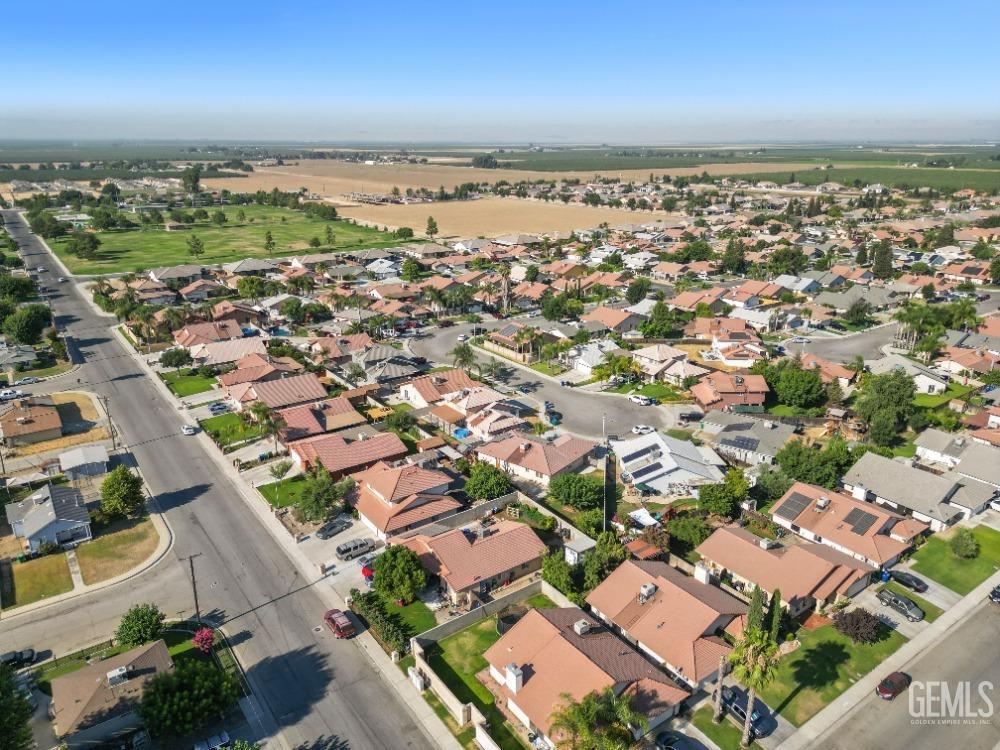 Undisclosed Address Shafter, CA 93263 - Photo 40 of 42 an aerial view of a city with lots of residential buildings and ocean view in back