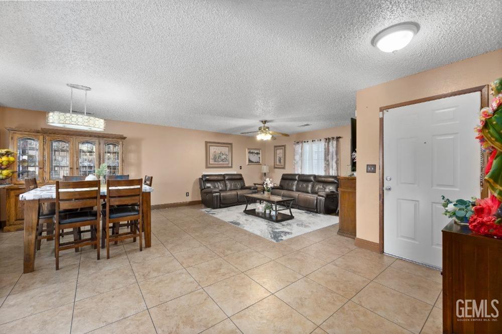 Undisclosed Address Shafter, CA 93263 - Photo 10 of 42 a living room with furniture and potted plants