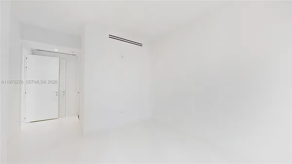 a bathroom with a sink mirror and shower