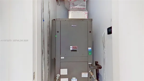 a close view of a utility room with dryer and washer
